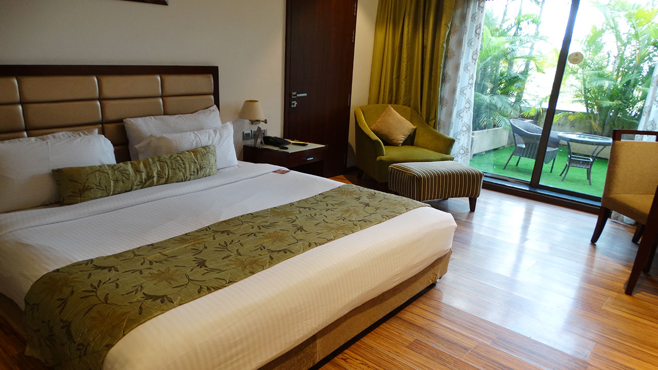 A spacious Garden room in Pune at Corinthians Pune Resort & Club